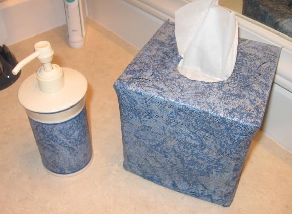 Matching tissue box and lotion dispenser in Script Cobalt Blue PaperIllusion wallpaper