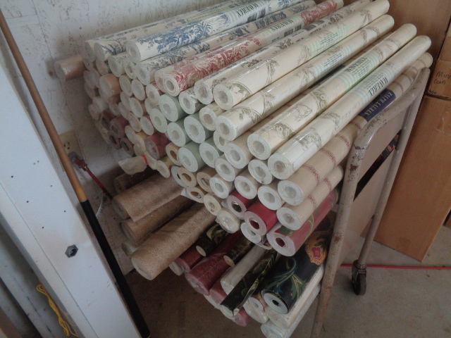 Rolls of wallpaper on a cart